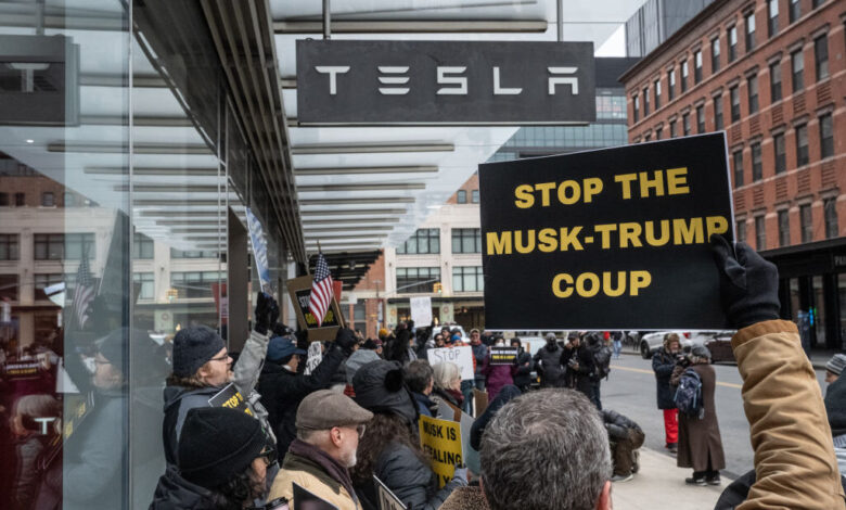 Protesters demonstrate outside Tesla showrooms in US Protesters demonstrate outside Tesla showrooms in US
